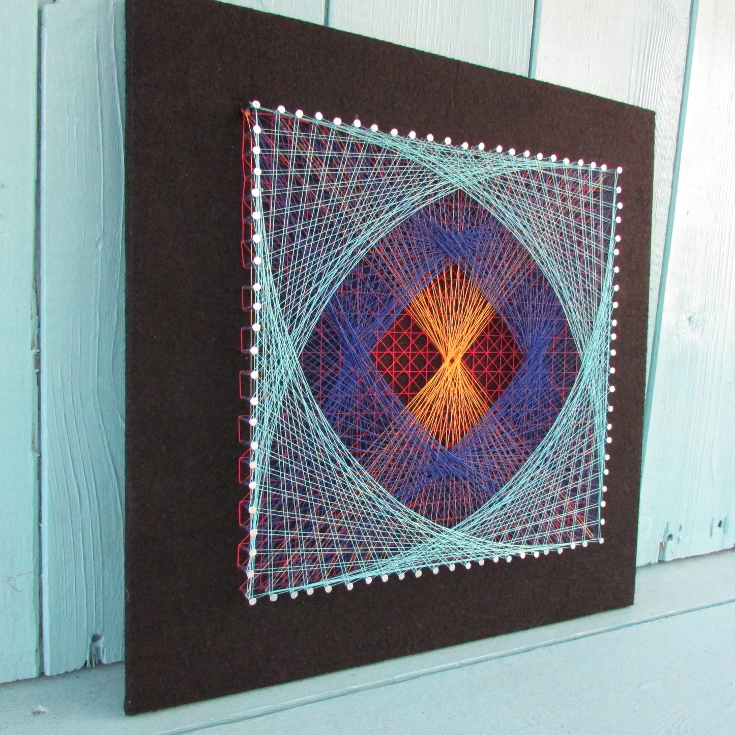 Home-made "Square" string art made from original 1973 pattern, black background