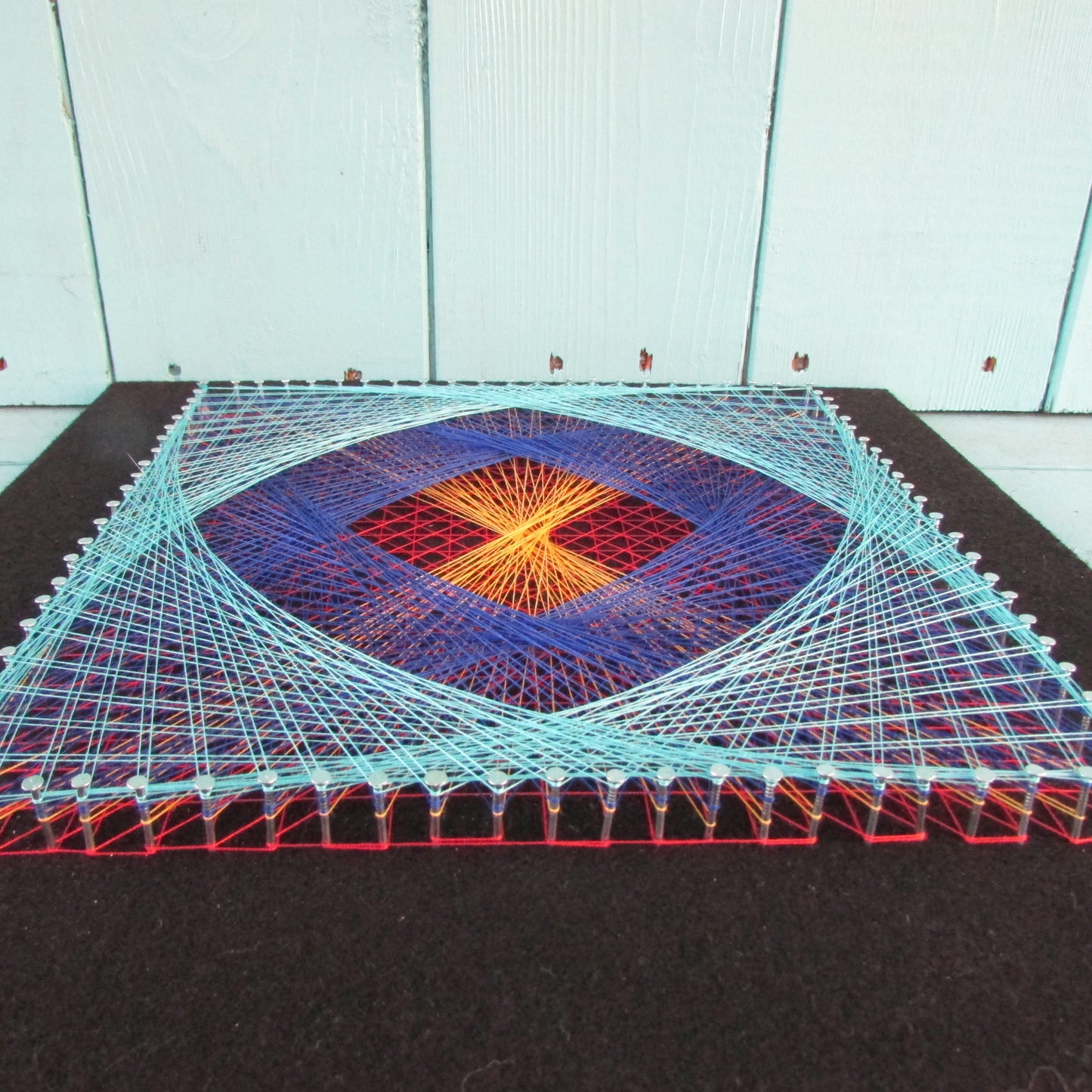 Home-made "Square" string art made from original 1973 pattern, black background