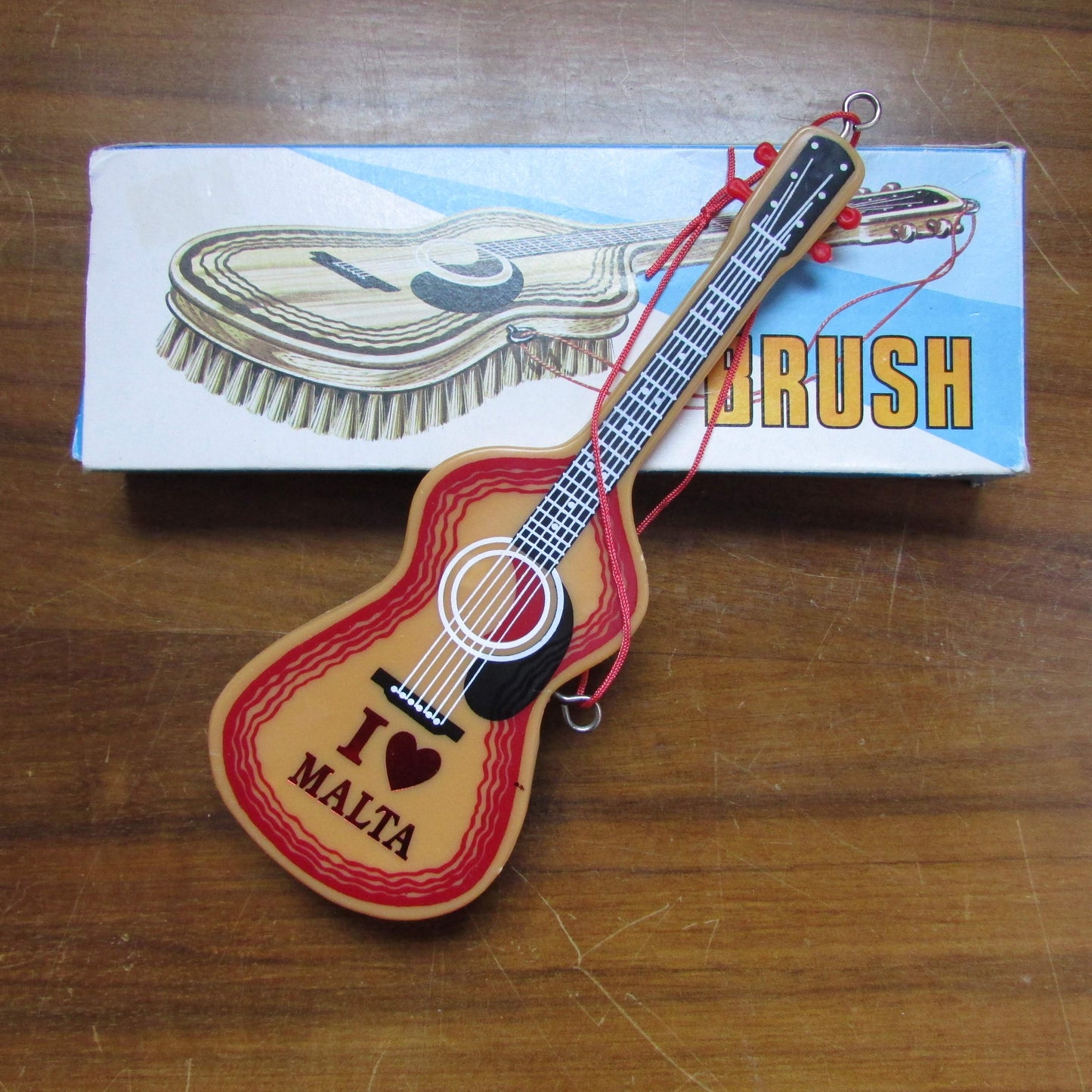 1970s/80s "I Love Malta" plastic guitar-shaped clothes/hair brush