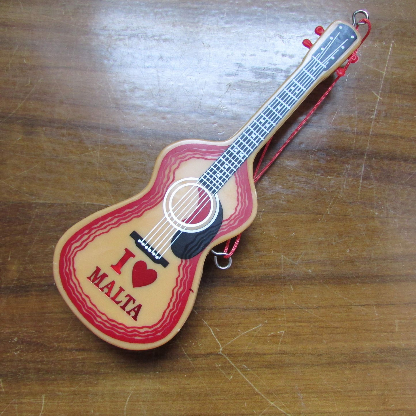 1970s/80s "I Love Malta" plastic guitar-shaped clothes/hair brush