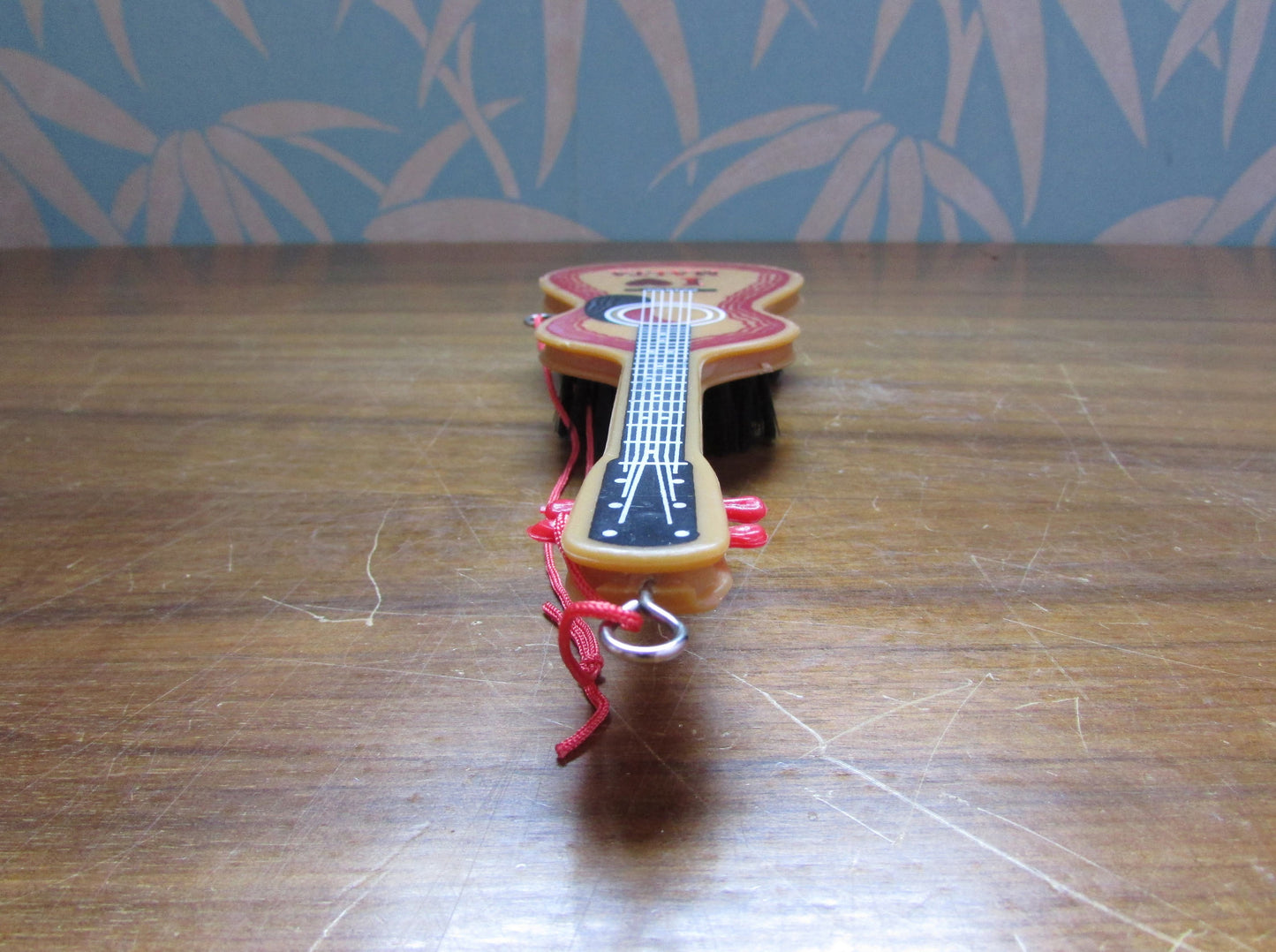 1970s/80s "I Love Malta" plastic guitar-shaped clothes/hair brush