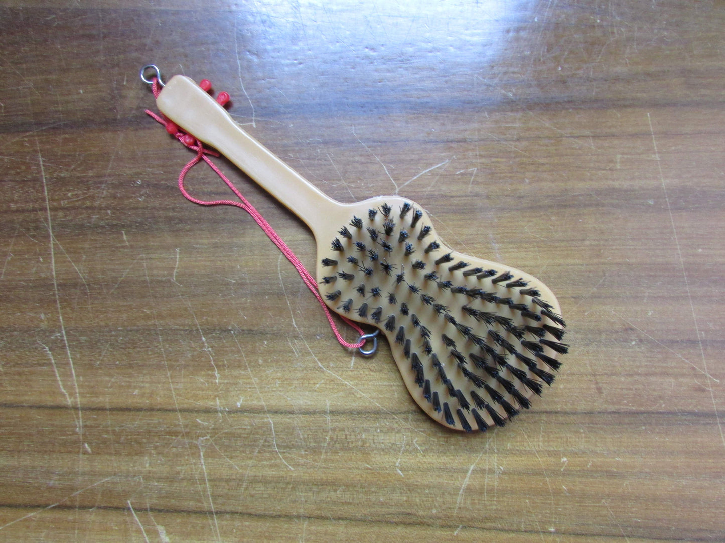 1970s/80s "I Love Malta" plastic guitar-shaped clothes/hair brush