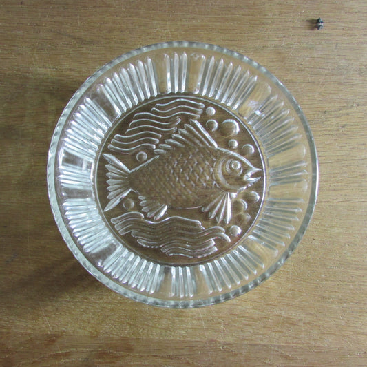 Vintage pressed glass bowl with fish ornamentation