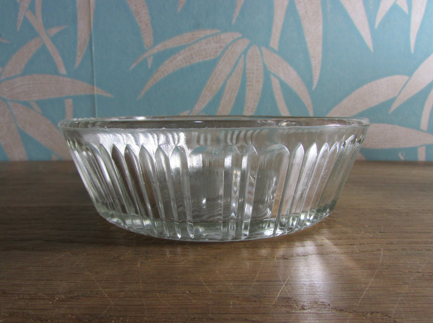 Vintage pressed glass bowl with fish ornamentation