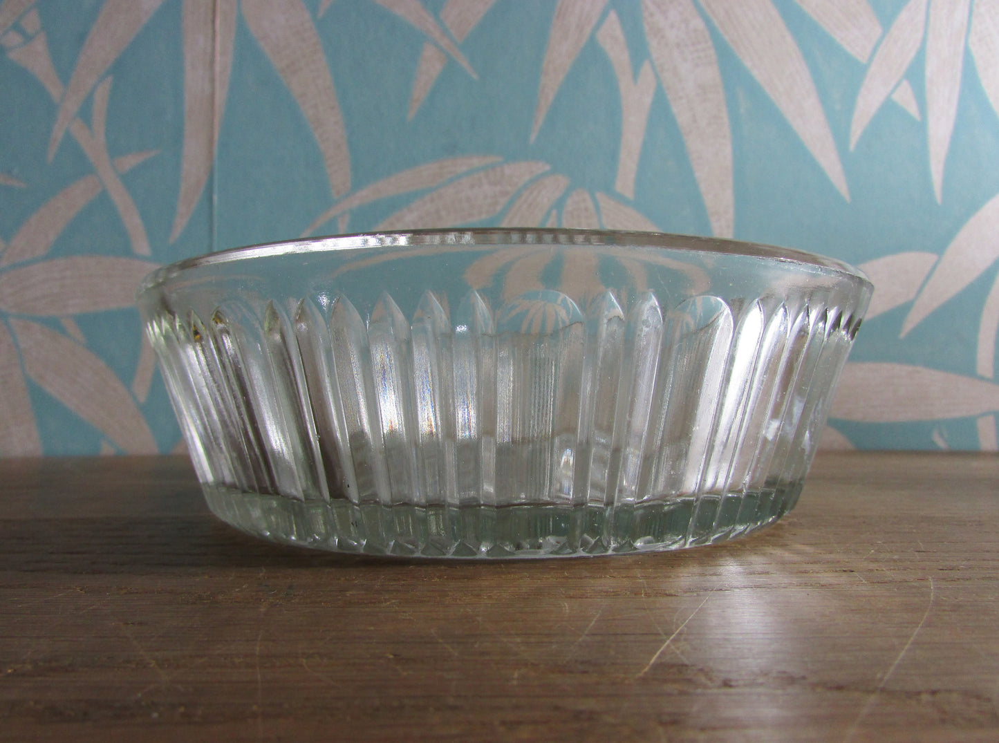 Vintage pressed glass bowl with fish ornamentation