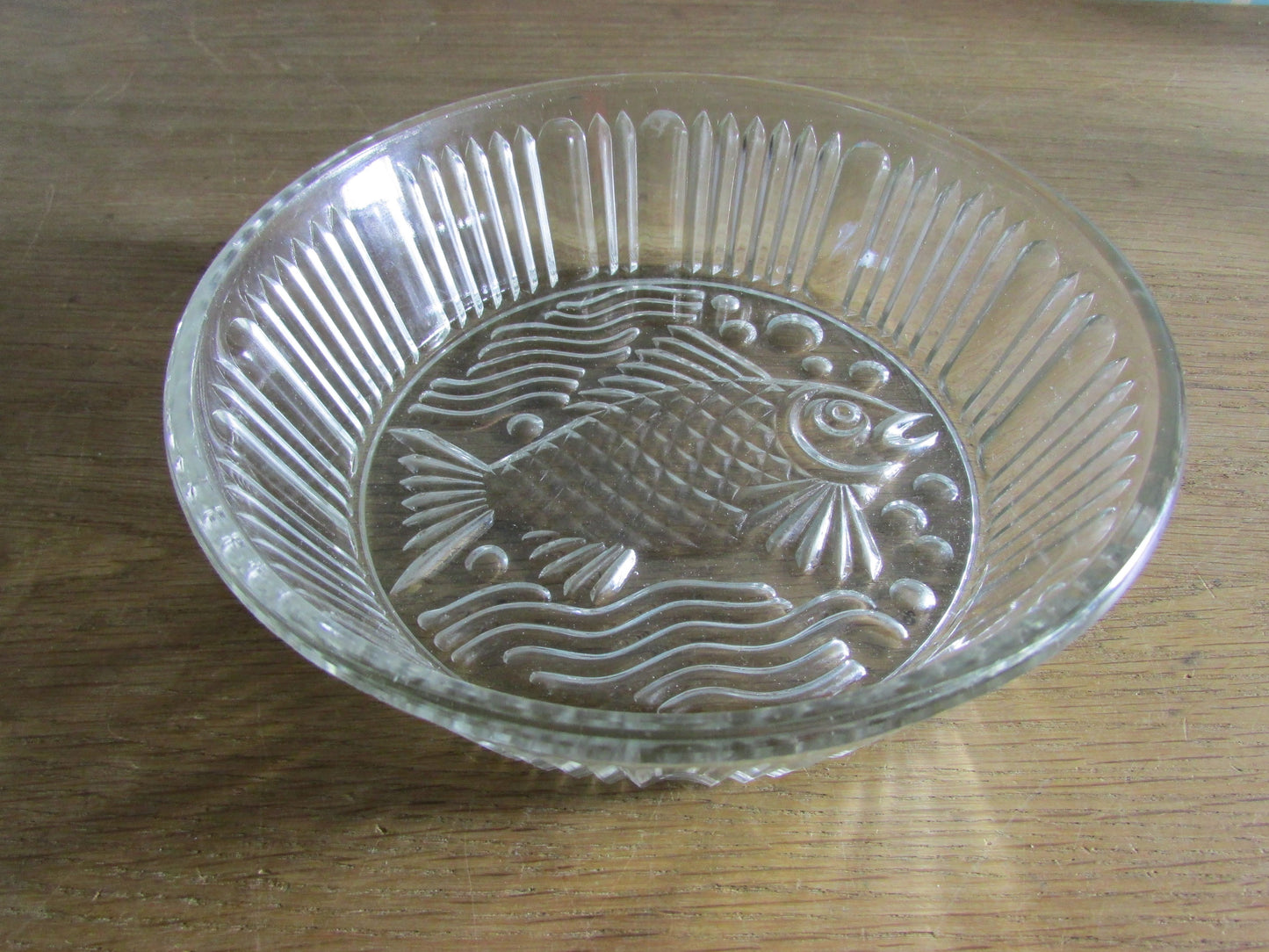 Vintage pressed glass bowl with fish ornamentation