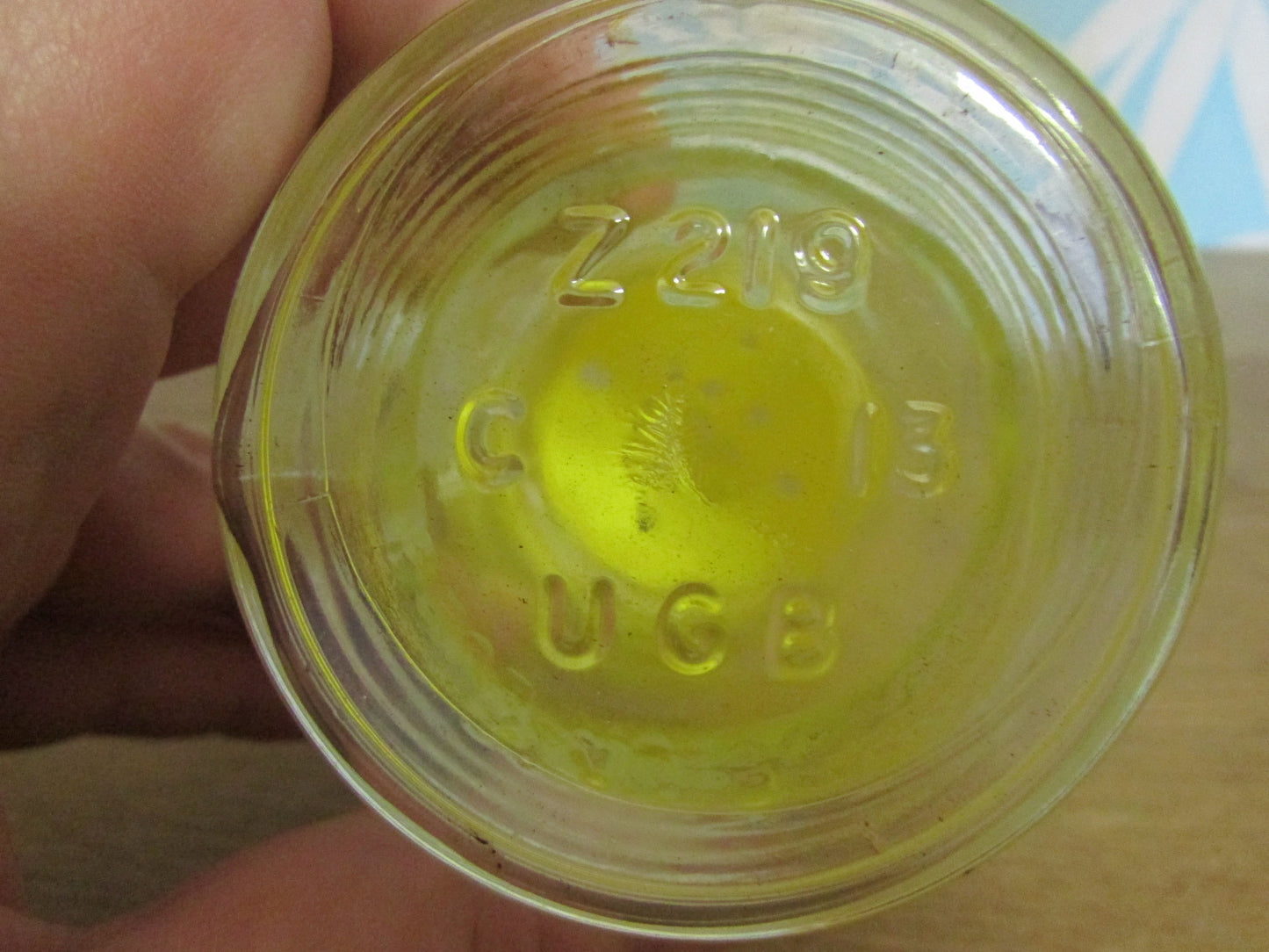 Pair of 1960s glass sugar pourers with yellow plastic lids