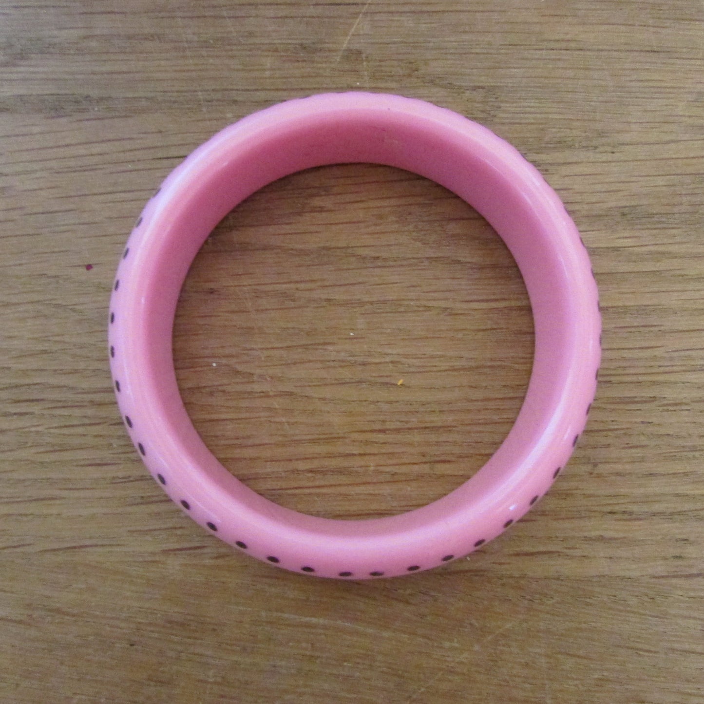circa. 1980s clear translucent, and pink polka dot acrylic bangle set
