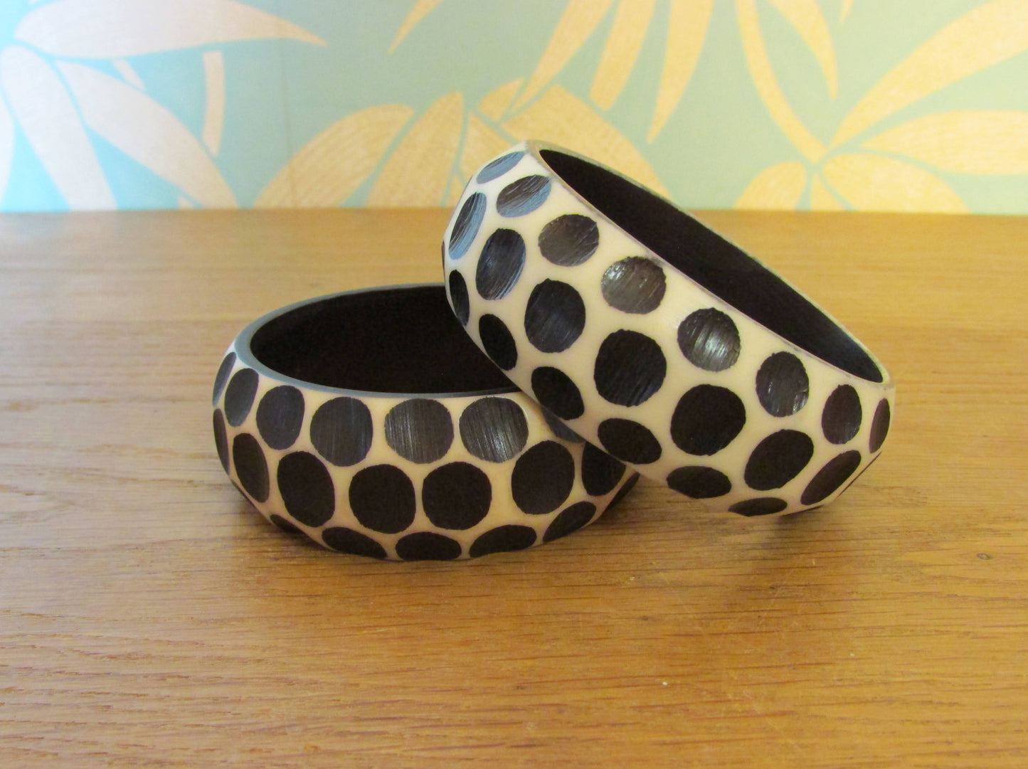Pair of 1960s carved resin monochrome polka dot bangles