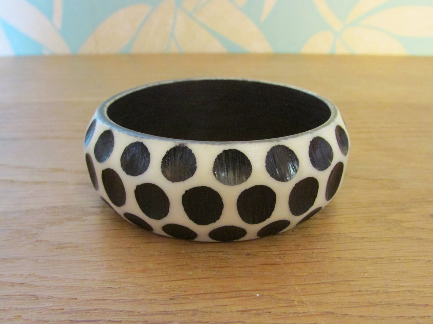 Pair of 1960s carved resin monochrome polka dot bangles