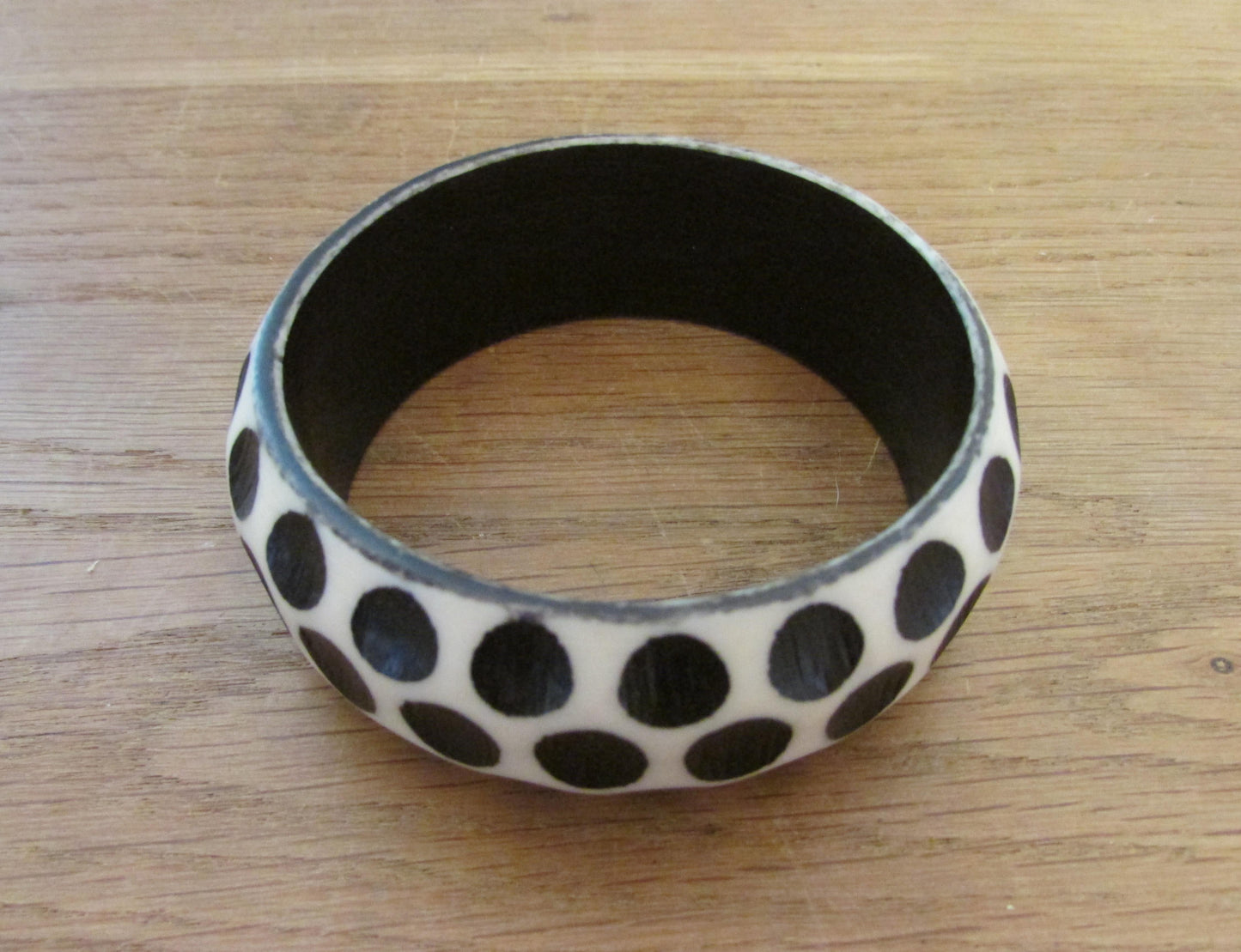 Pair of 1960s carved resin monochrome polka dot bangles