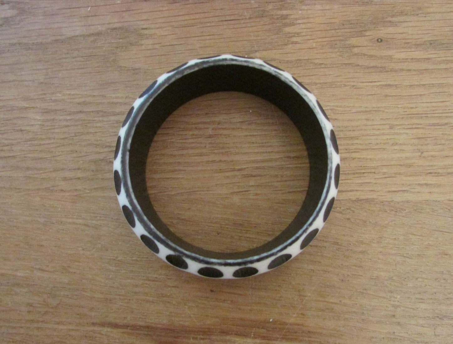 Pair of 1960s carved resin monochrome polka dot bangles
