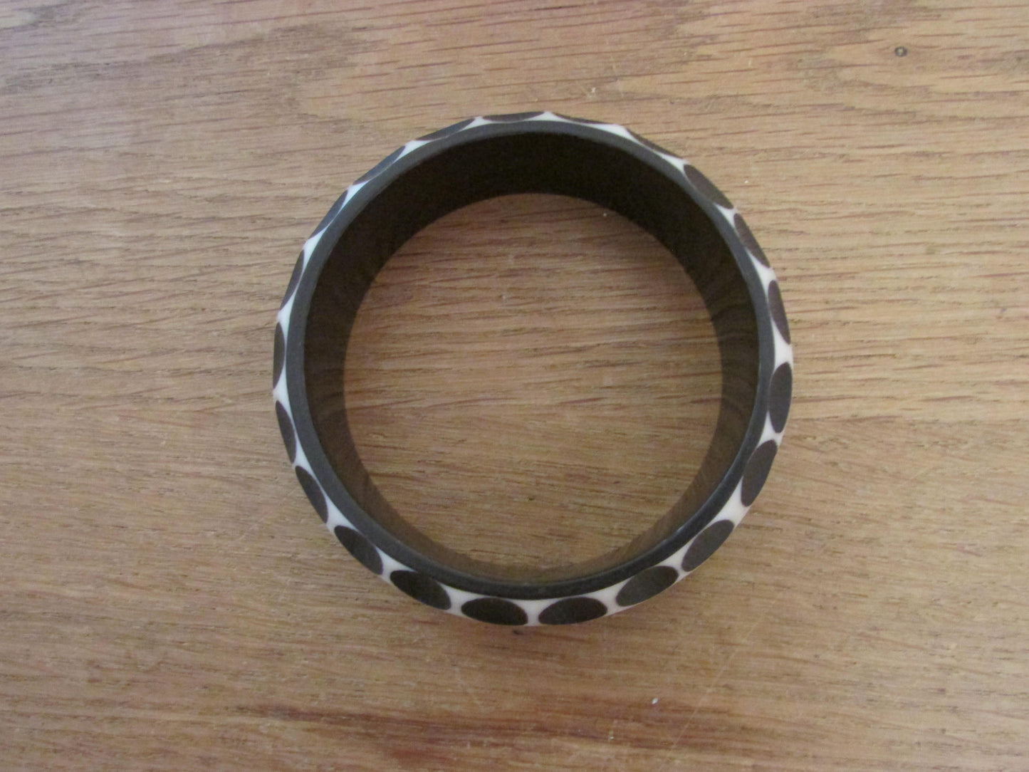 Pair of 1960s carved resin monochrome polka dot bangles