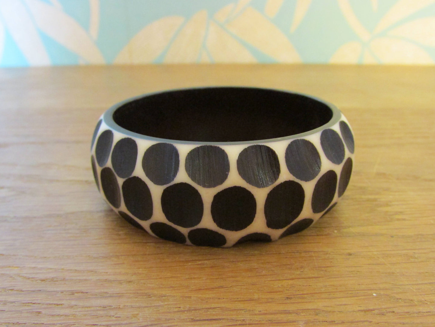 Pair of 1960s carved resin monochrome polka dot bangles