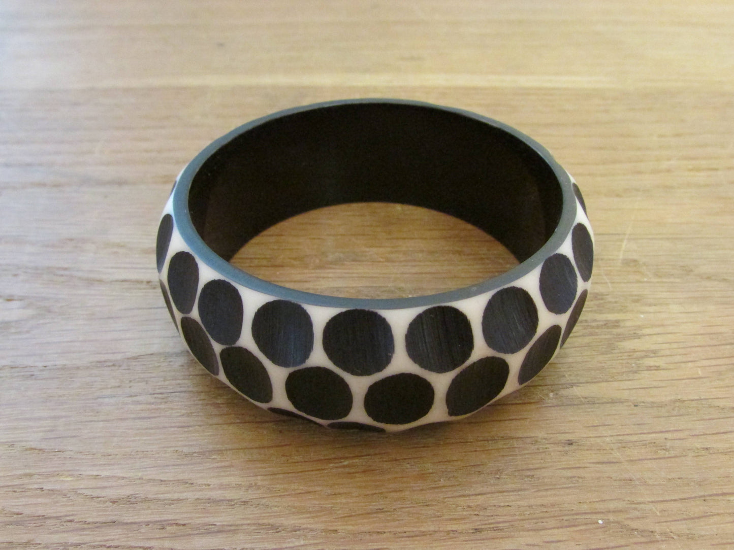 Pair of 1960s carved resin monochrome polka dot bangles