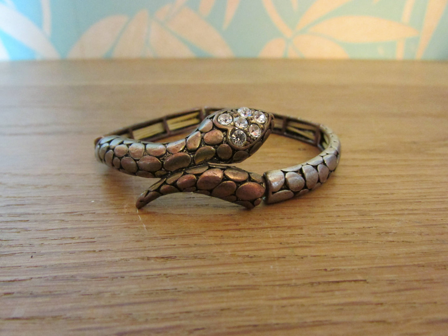 Vintage metal-tone stretch snake bangle with diamanté detail to head