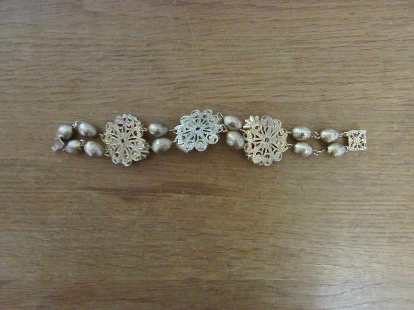 1950s gold-tone & bead bracelet with ruby red and pink faceted beads