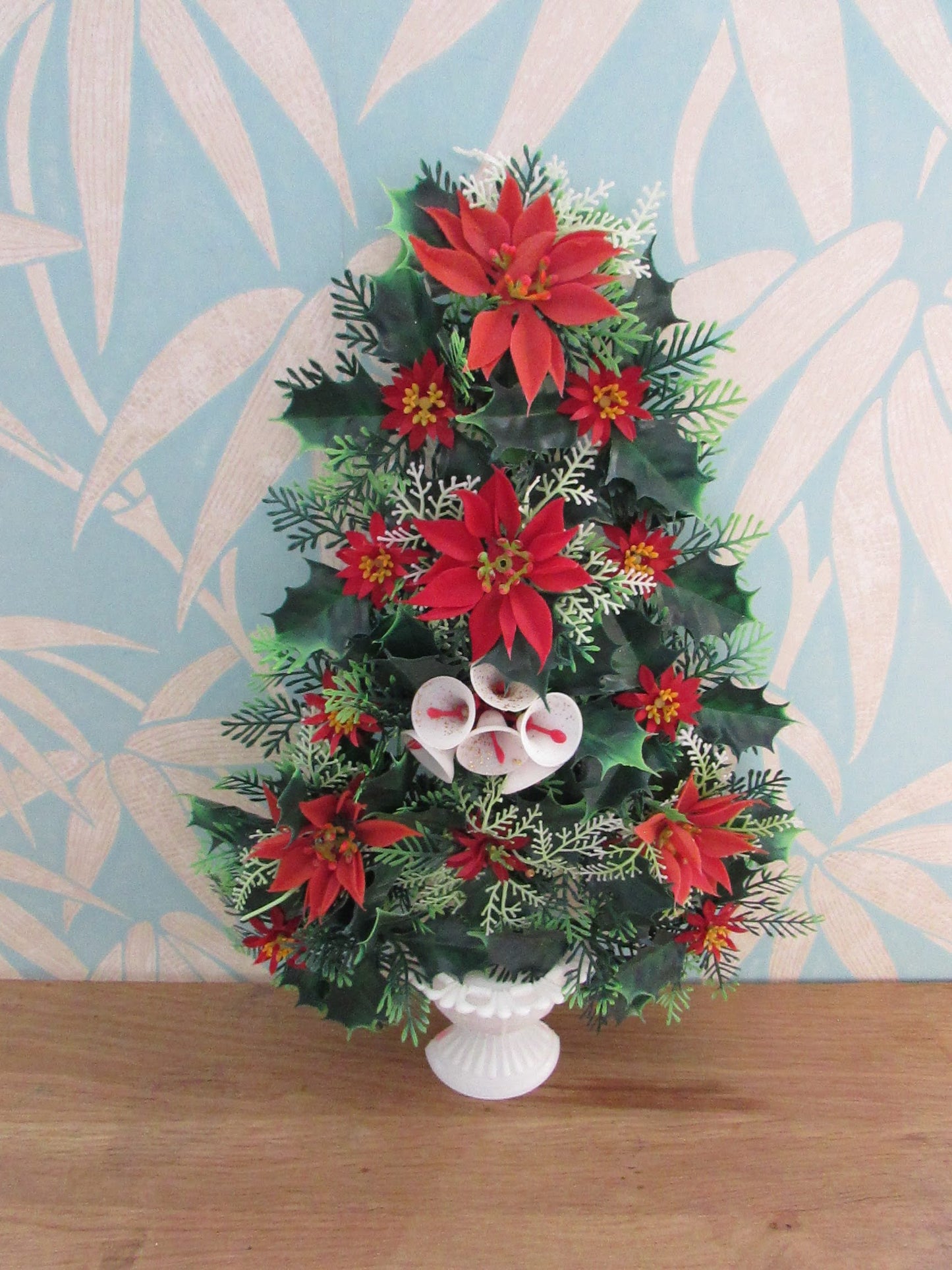 1970s plastic miniature wall-hanging Christmas tree festooned with Poinsettia
