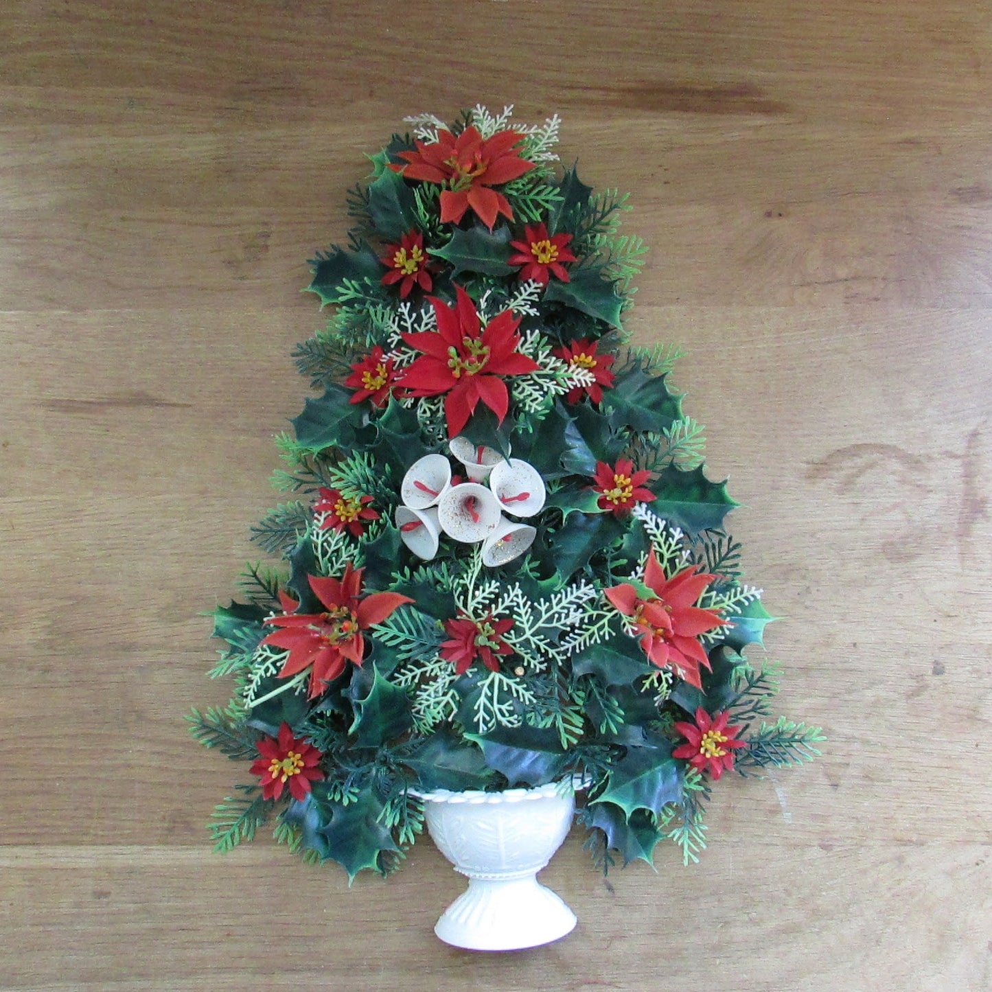 1970s plastic miniature wall-hanging Christmas tree festooned with Poinsettia