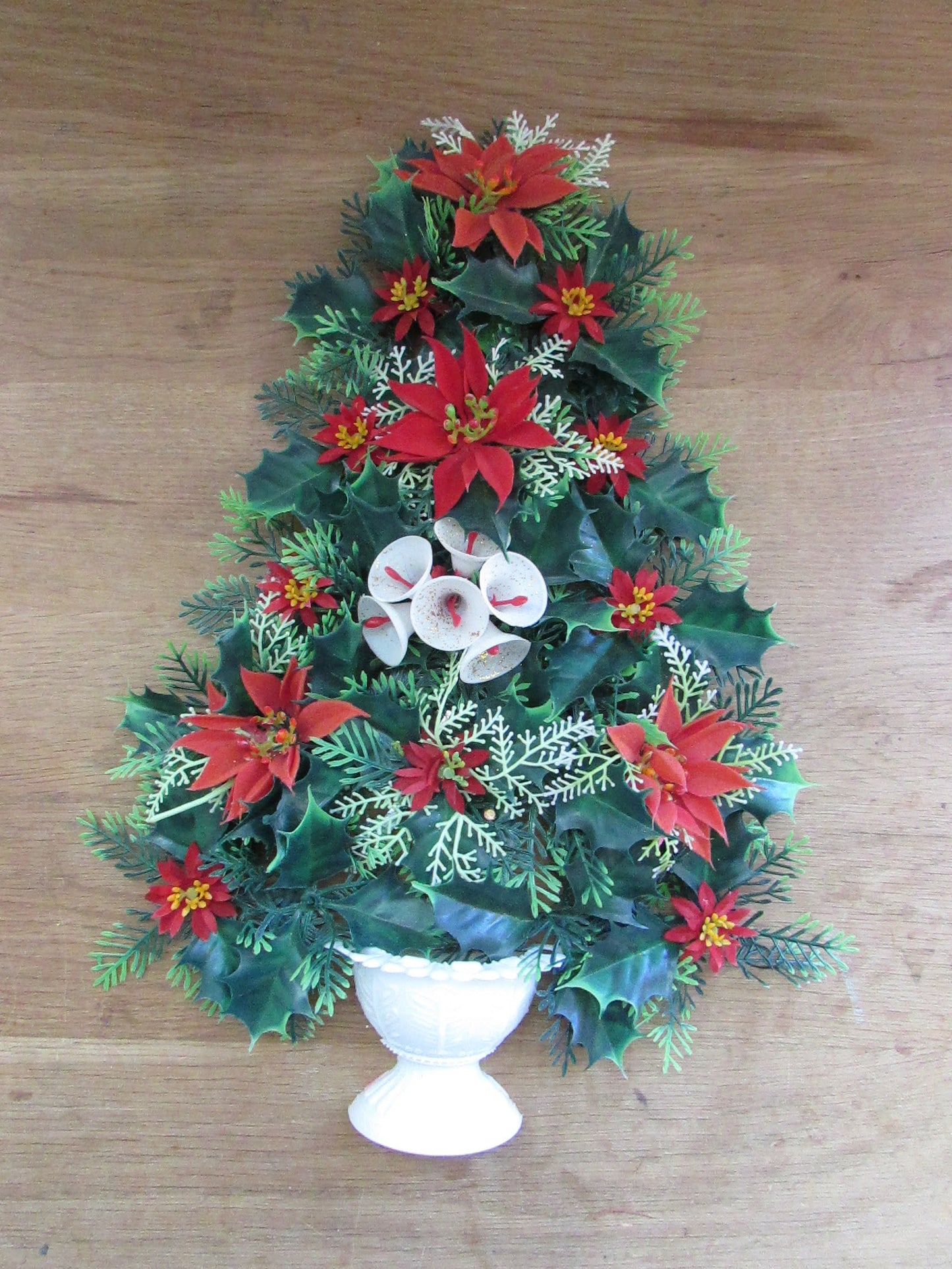 1970s plastic miniature wall-hanging Christmas tree festooned with Poinsettia