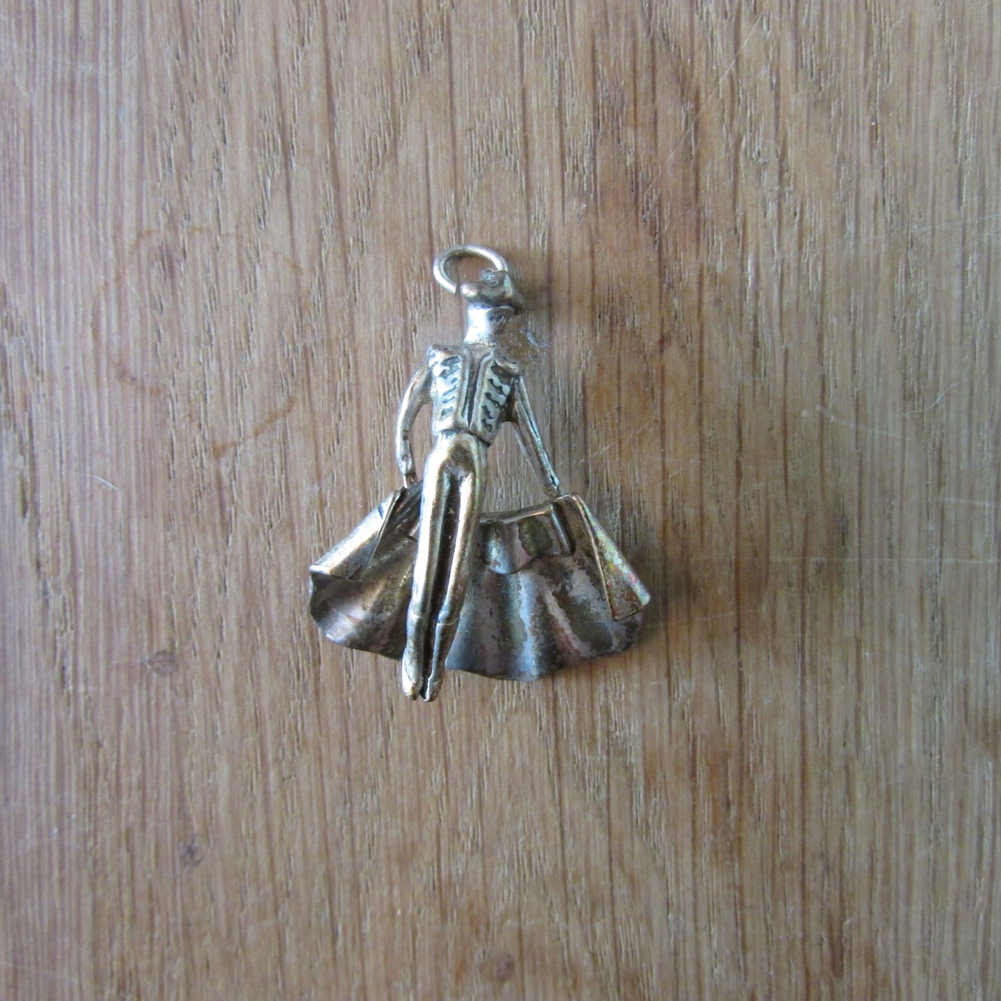 Vintage silver-tone matador charm