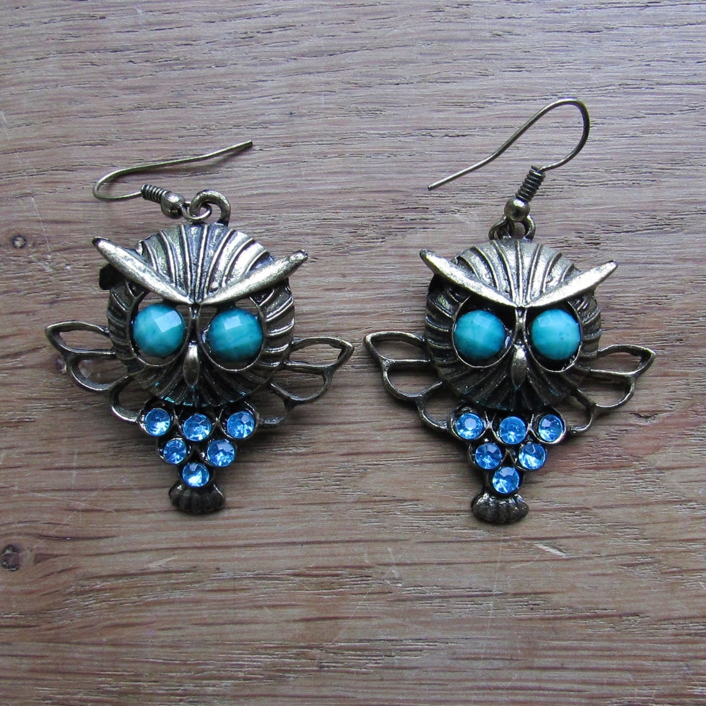 1980s gold-tone owl drop earrings with green cabochon eyes & turquoise rhinestone detail
