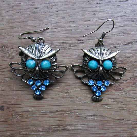 1980s gold-tone owl drop earrings with green cabochon eyes & turquoise rhinestone detail