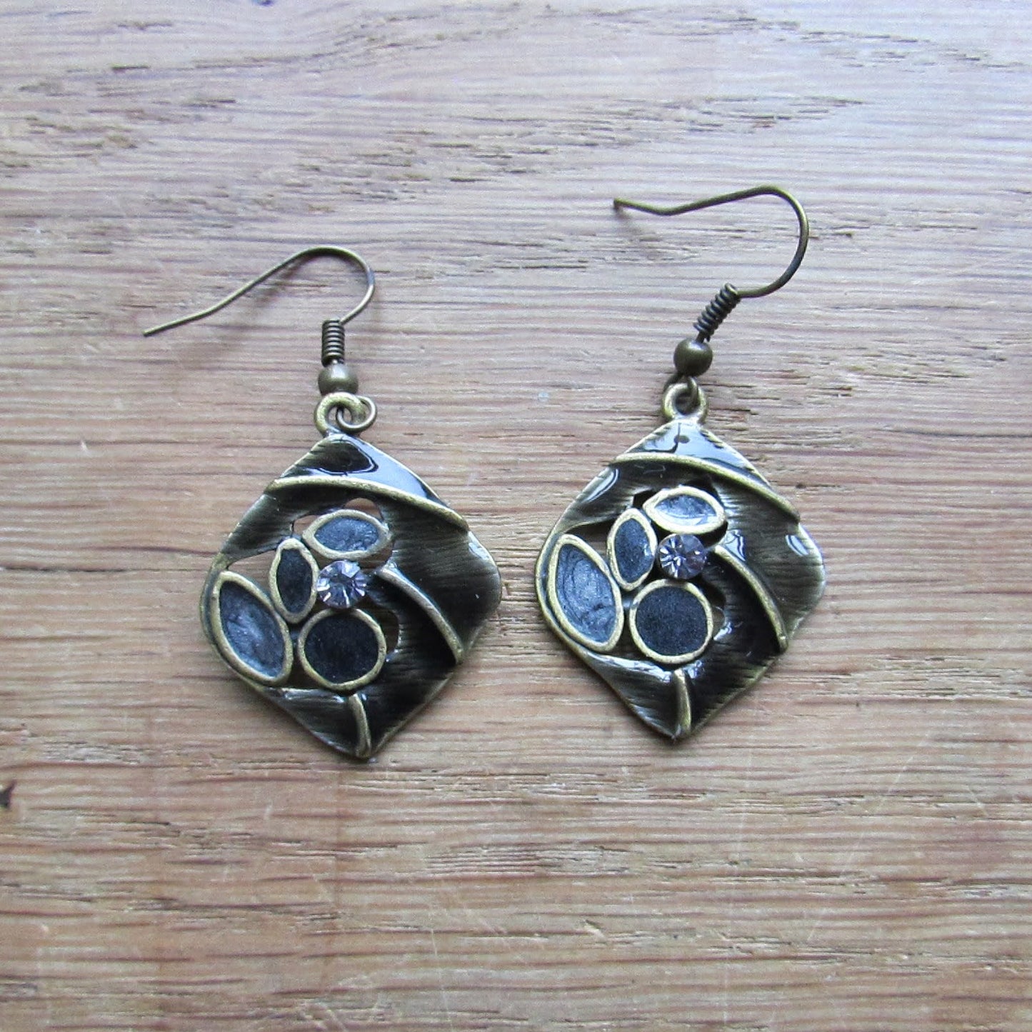 1970s/80s brass-tone abstract drop earrings with black enamel and rhinestone detail