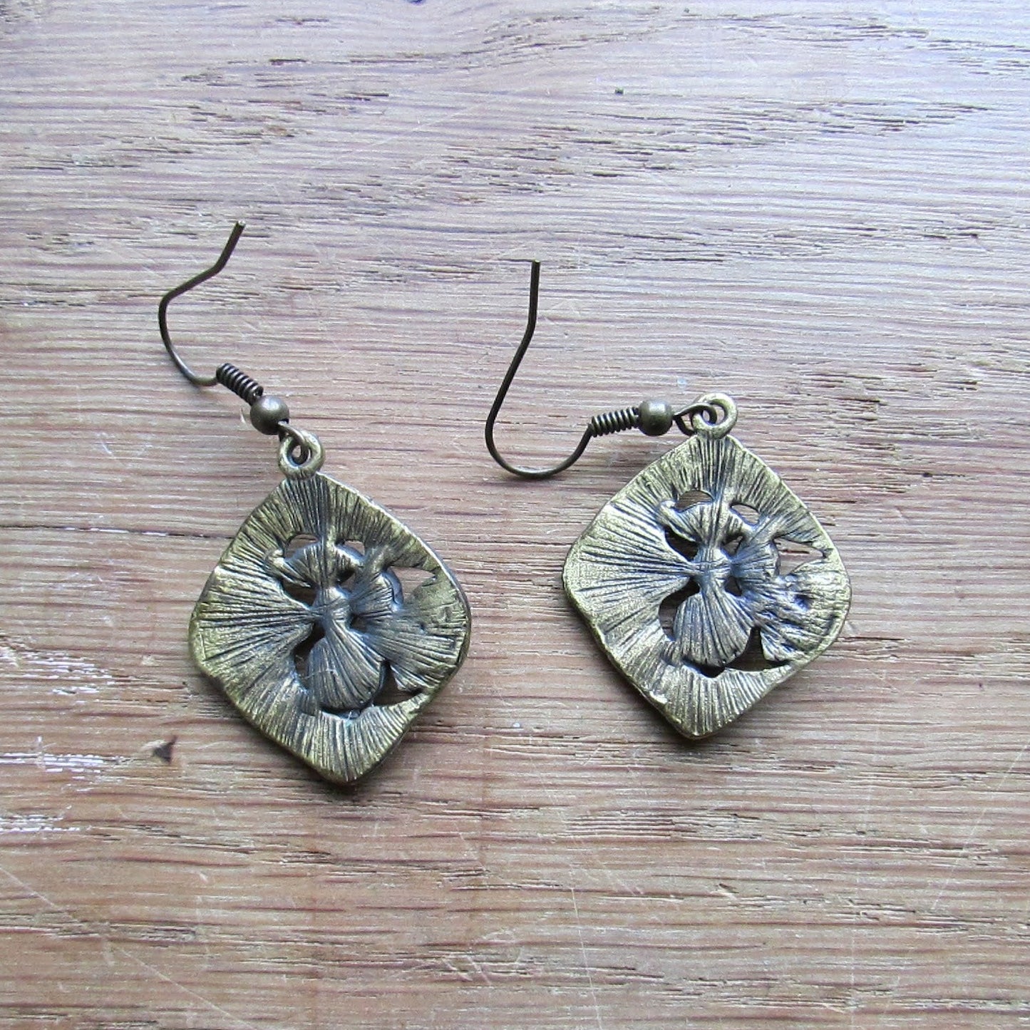1970s/80s brass-tone abstract drop earrings with black enamel and rhinestone detail