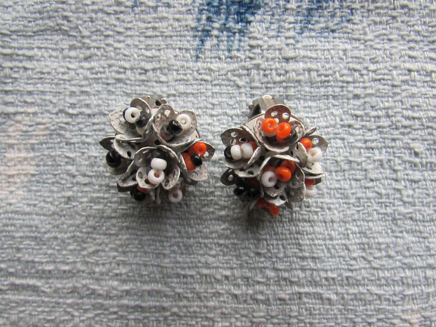 1960s articulated white/orange/black cluster seed bead clip-on earrings
