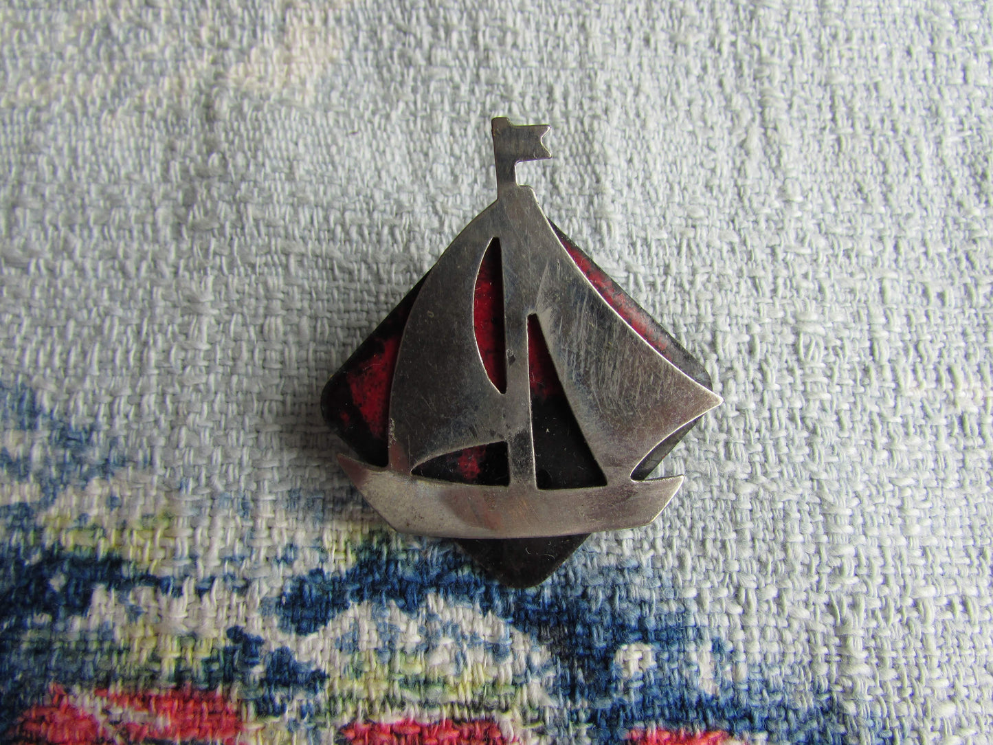 Home-made brooch using vintage minature metal yacht and vintage enamel piece jewellery pieces