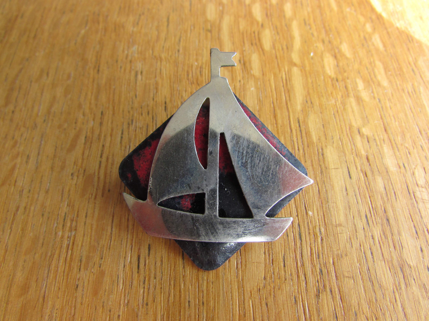 Home-made brooch using vintage minature metal yacht and vintage enamel piece jewellery pieces