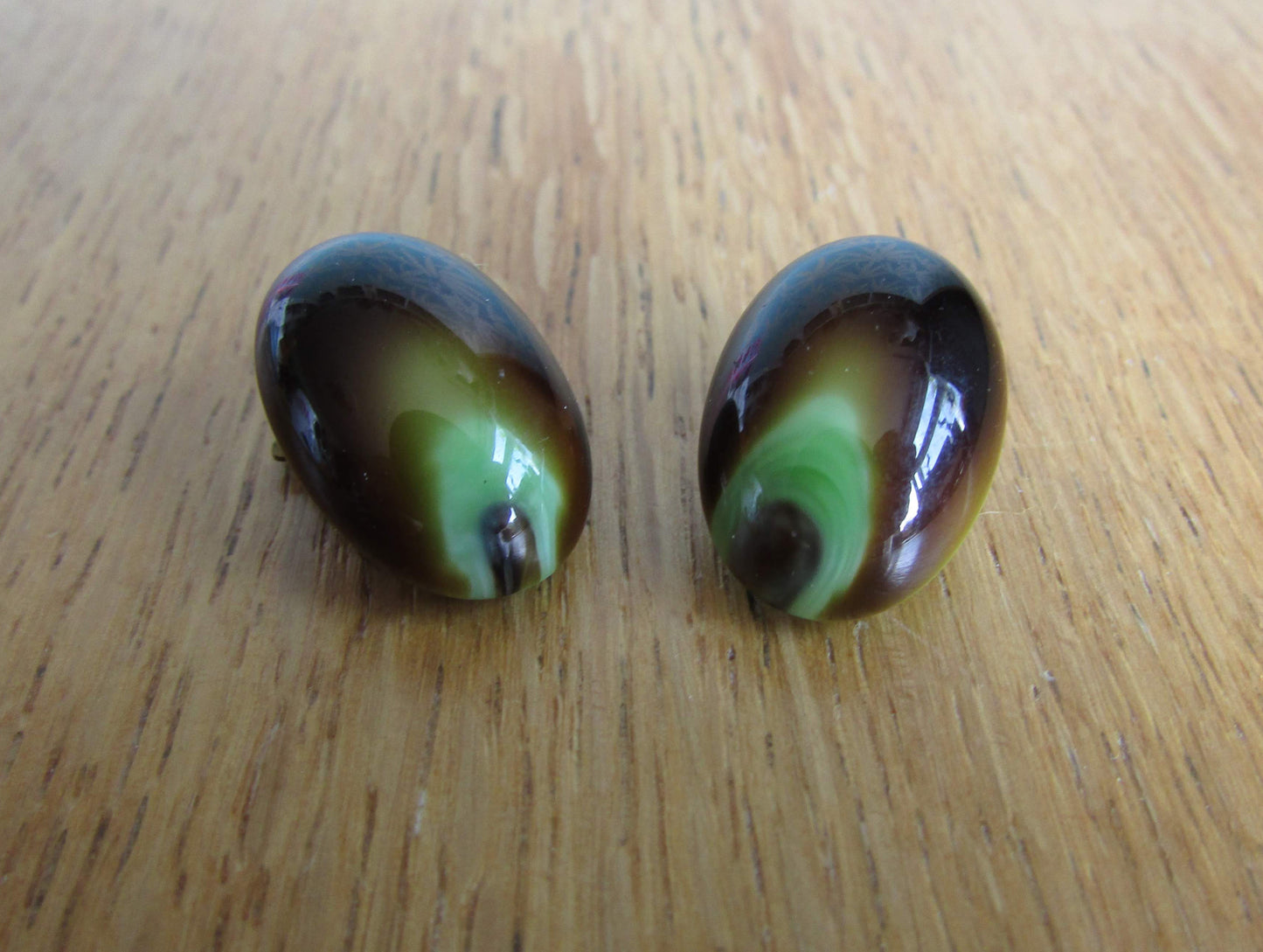 Vintage pastille-shaped peacock occelus-inspired glass clip-on earrings