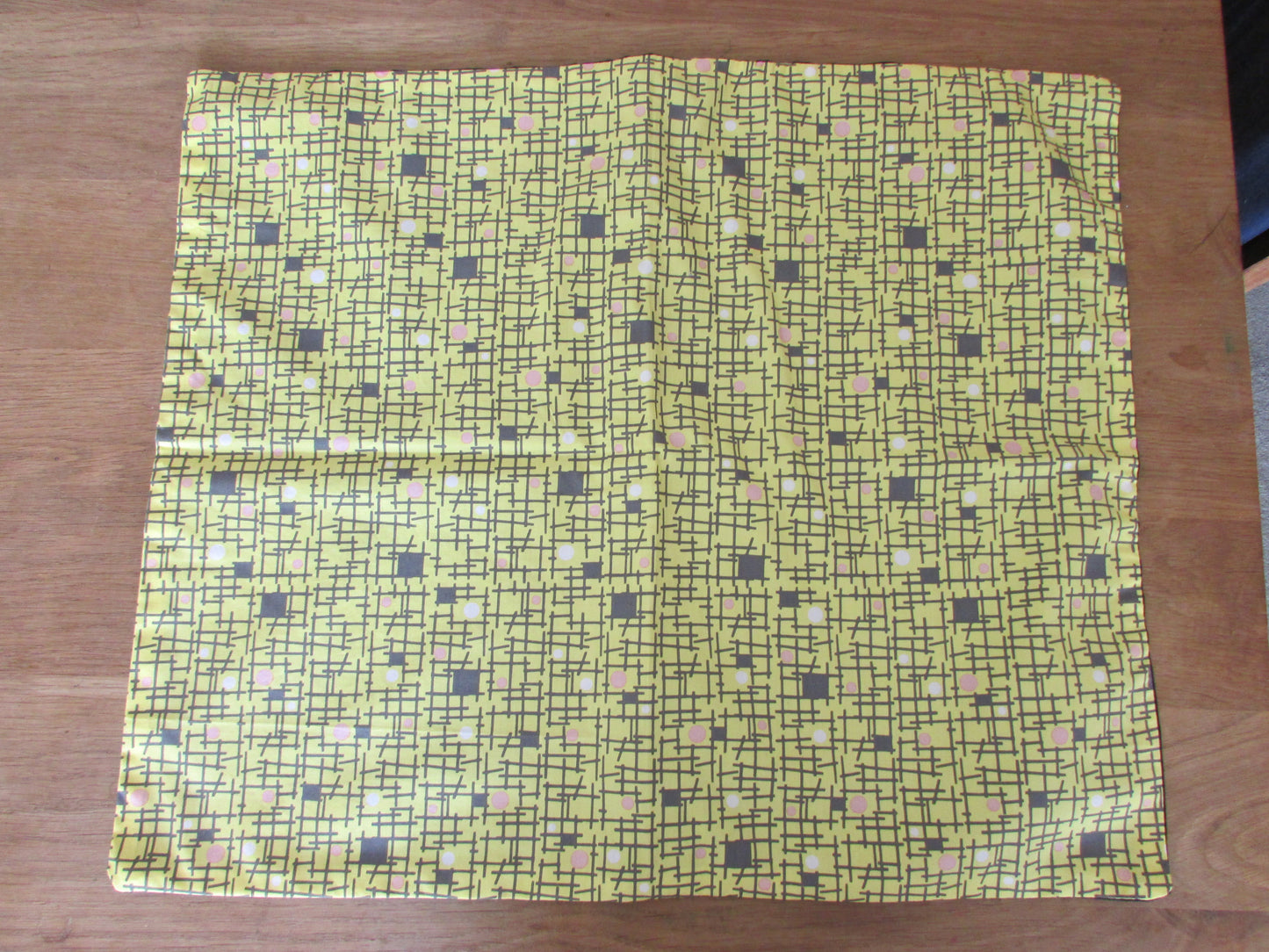 Home-made 1950s yellow & back abstract pattern cushion cover with contrast black reverse