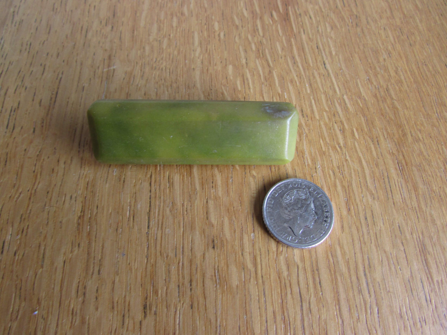 Art Deco green bevelled plastic solid rectangular bar brooch
