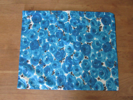 Home-made mid-century blue repeat rose cushion cover with contrast black reverse