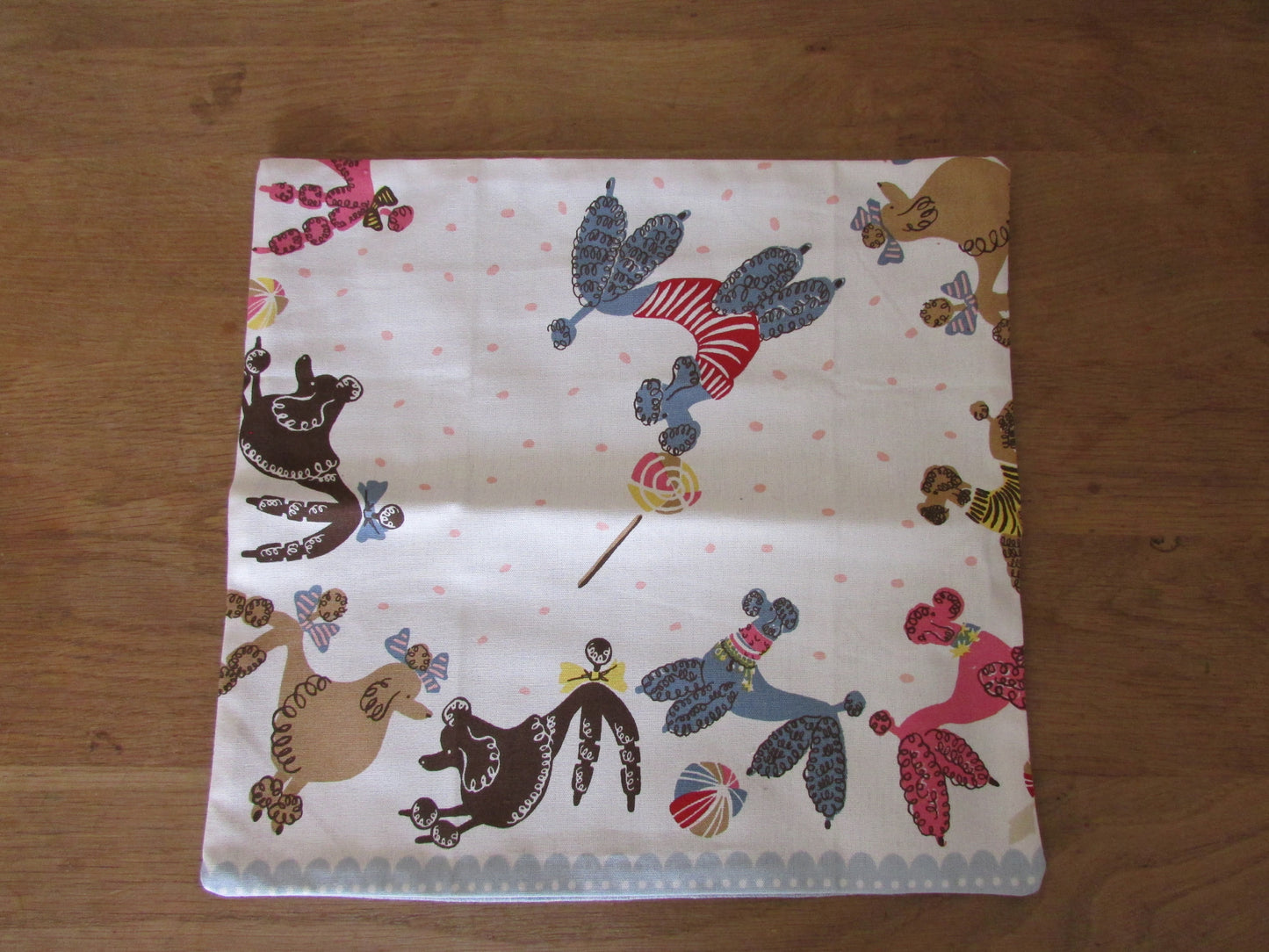 Home-made 1950s-style poodles cushion cover with contrast reverse
