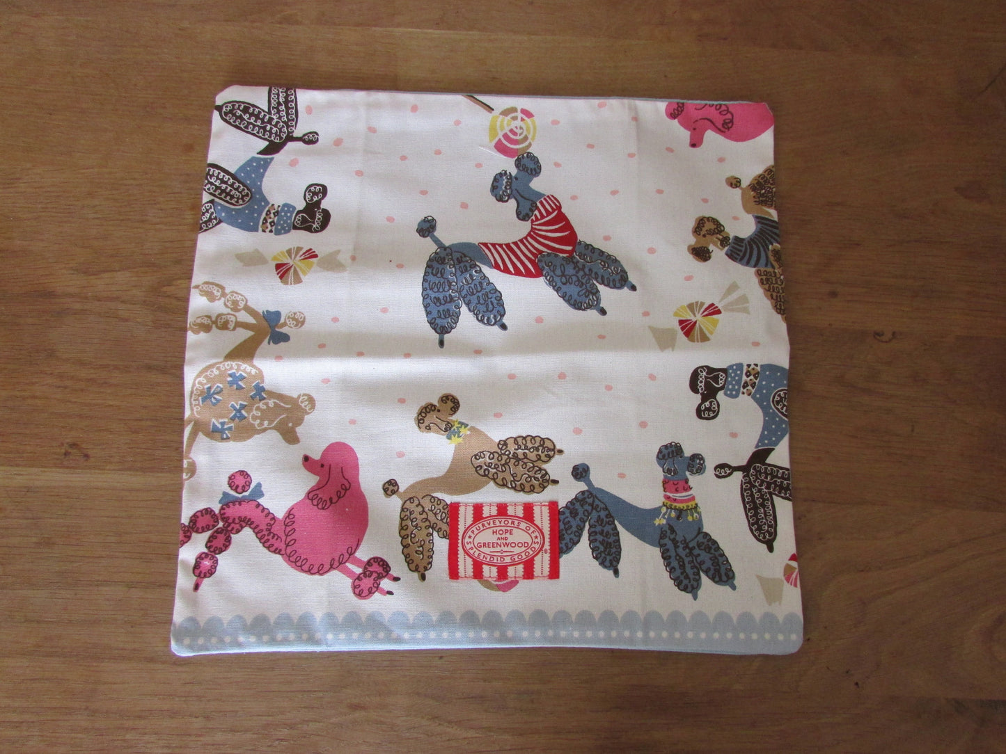 Home-made 1950s-style poodles cushion cover with contrast reverse & logo