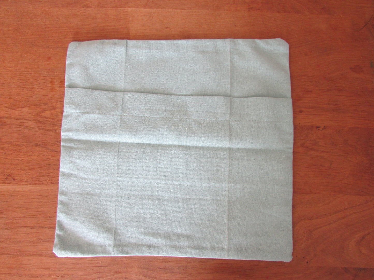 Home-made 1950s-style poodles cushion cover with contrast reverse & logo