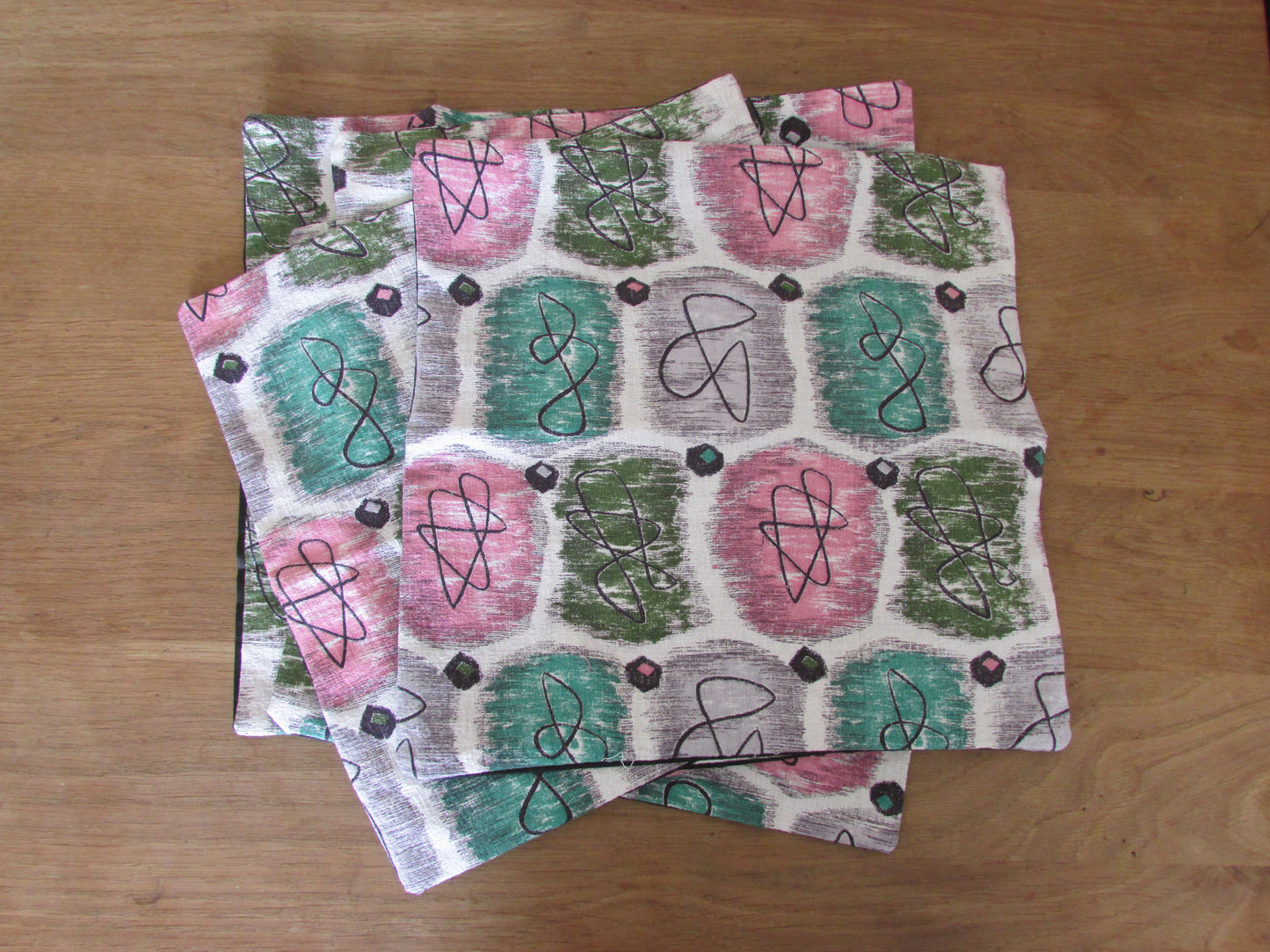 Home-made 1950s pink & green atomic barkcloth cushion cover with contrast black reverse