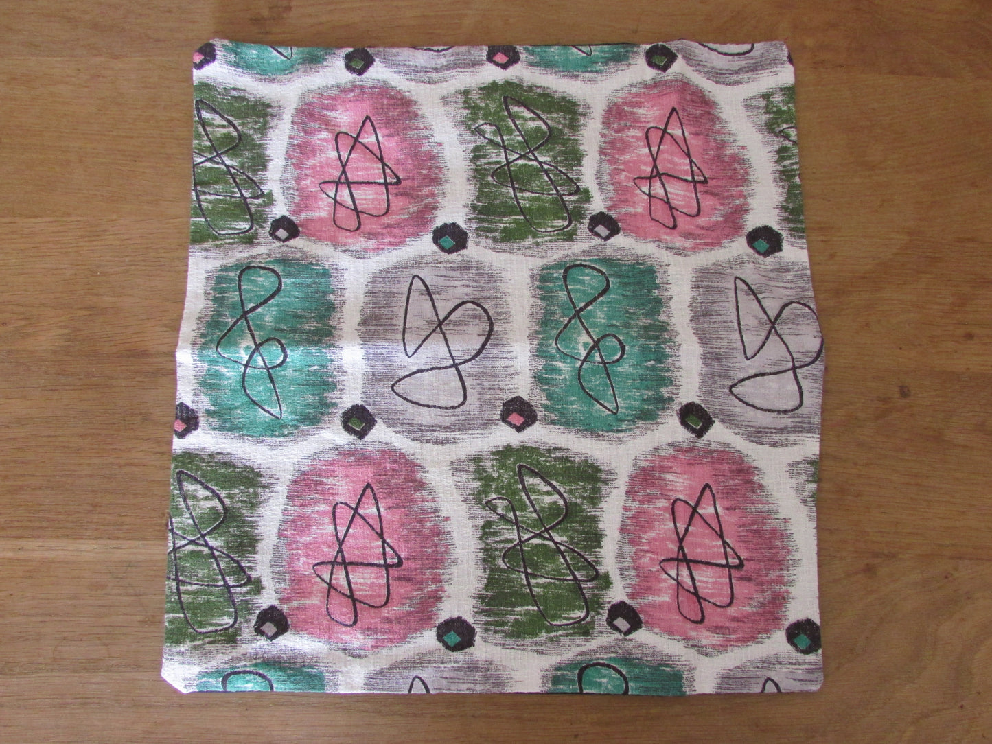 Home-made 1950s pink & green atomic barkcloth cushion cover with contrast black reverse