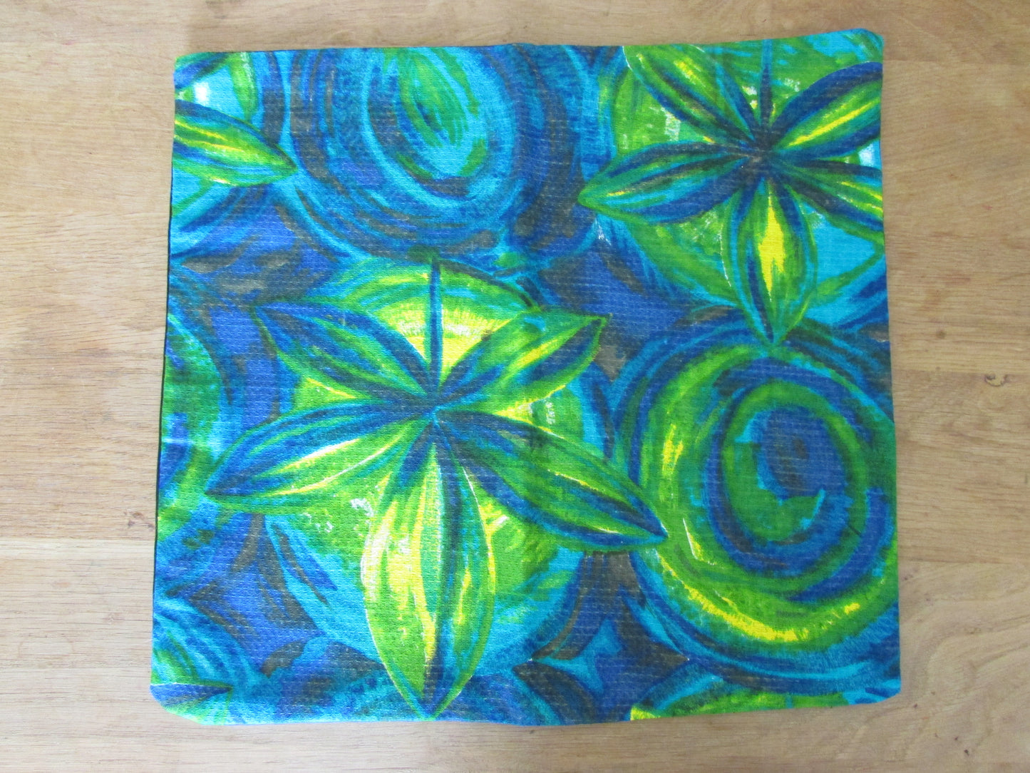 Home-made vintage bright blue & green pattern barkcloth cushion cover with contrast black reverse