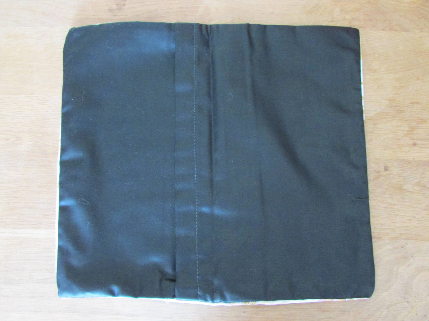 Home-made vintage floral cushion cover with contrast black reverse