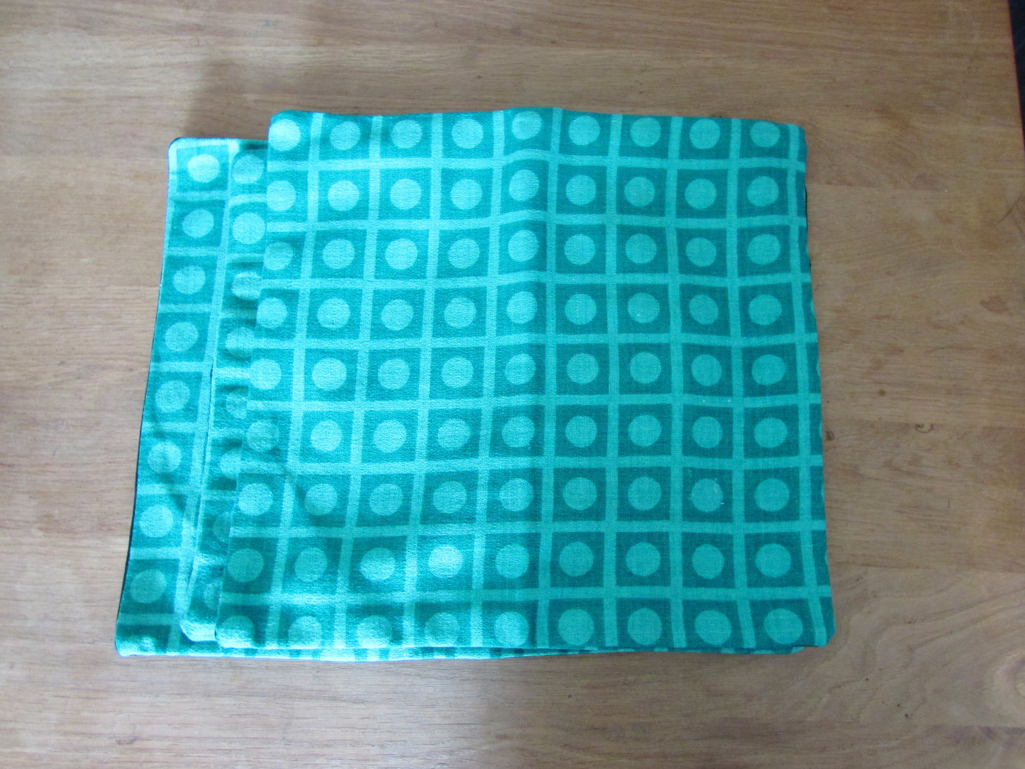 Home-made vintage green op art pattern cushion cover with contrast black reverse