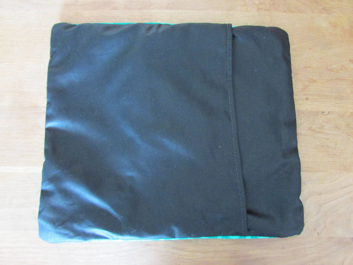 Home-made vintage green op art pattern cushion cover with contrast black reverse