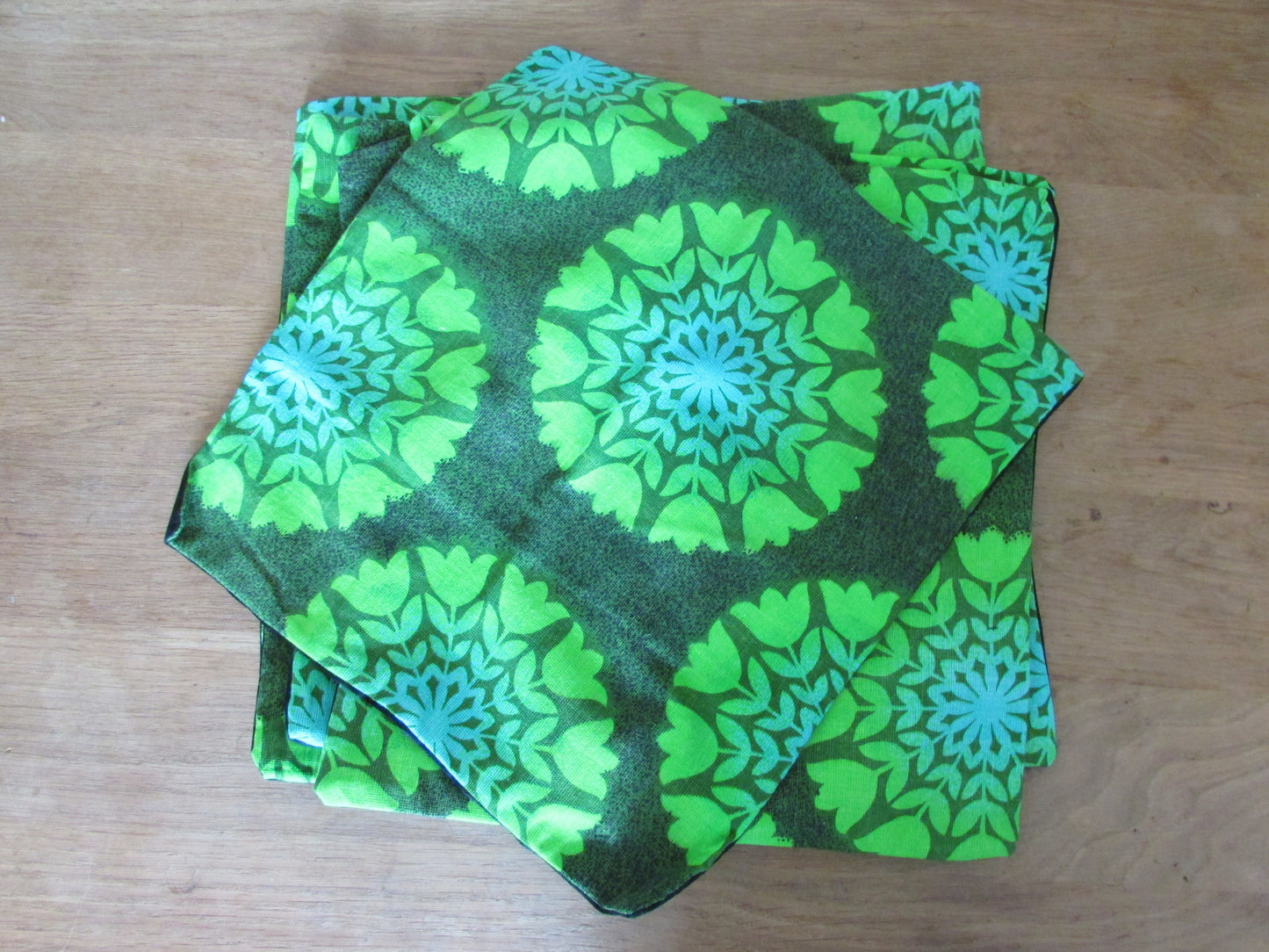 Home-made vintage green tulips circles cushion cover with contrast black reverse