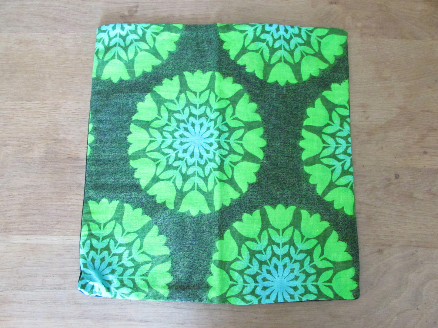 Home-made vintage green tulips circles cushion cover with contrast black reverse