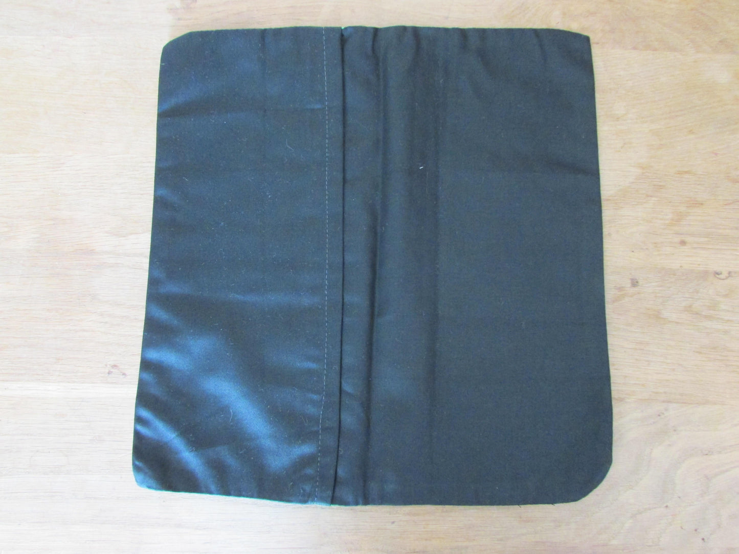 Home-made vintage green tulips circles cushion cover with contrast black reverse