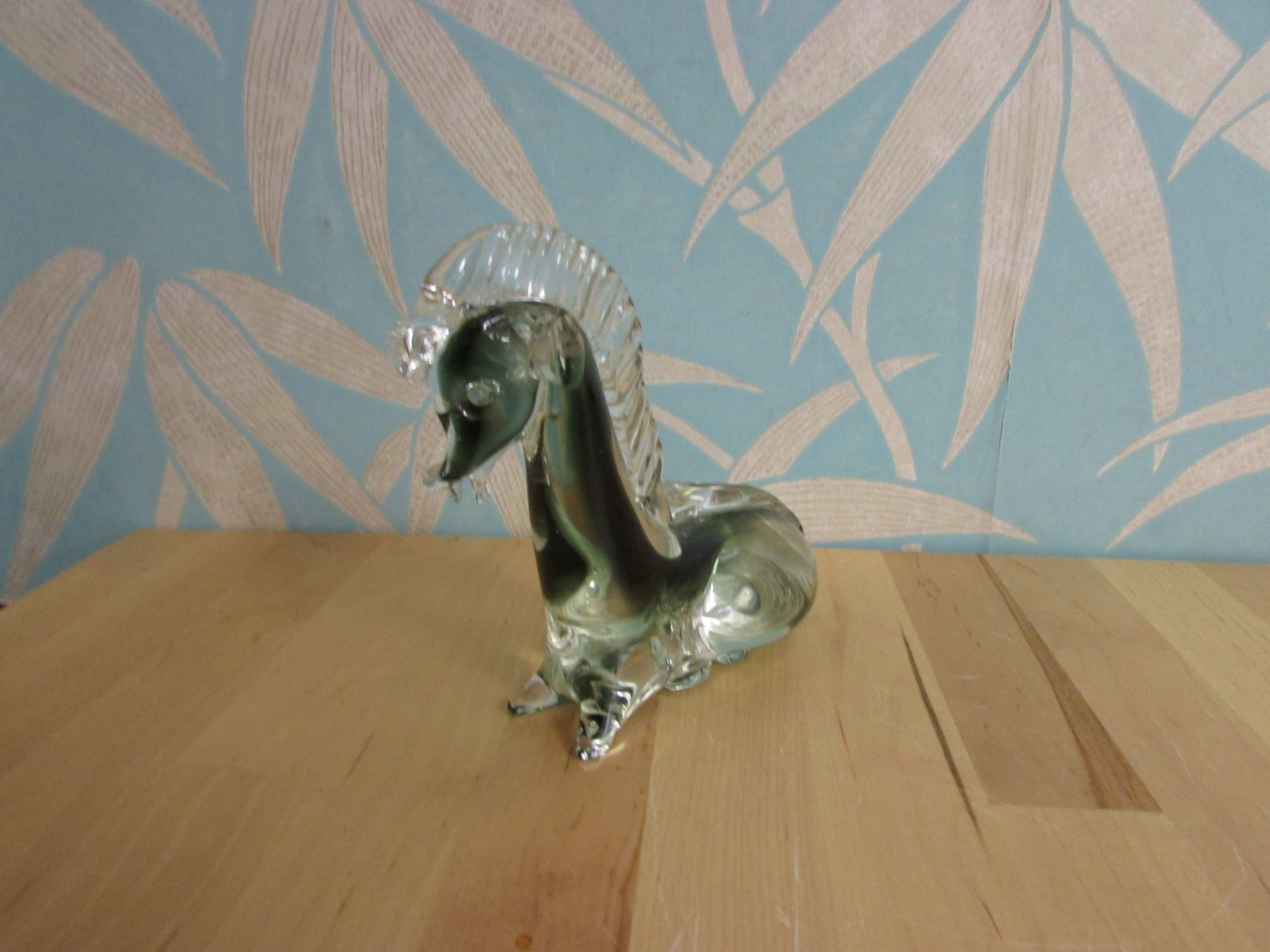 Vintage solid glass Trojan-style resting horse statuette