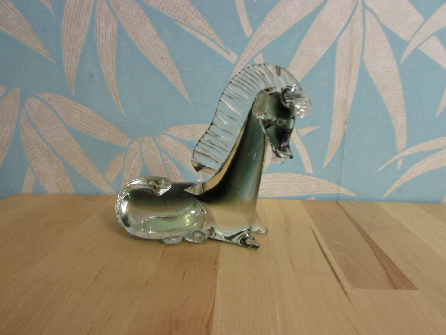 Vintage solid glass Trojan-style resting horse statuette